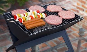 #8. Fire Sense Black Notebook Charcoal Grill